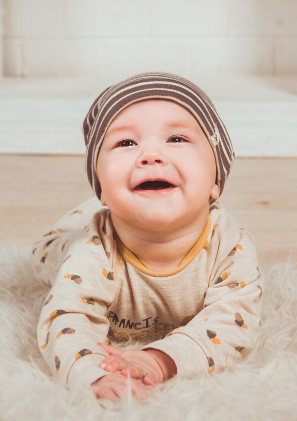 Baby smiling at camera