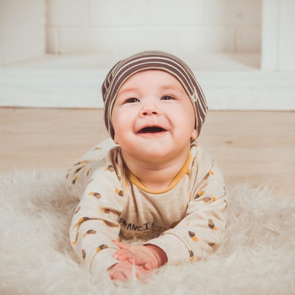 Baby smiling at camera